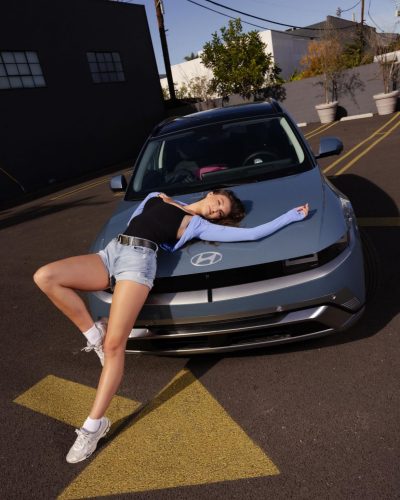 Rachel Pizzolato red dress with long flowing hair