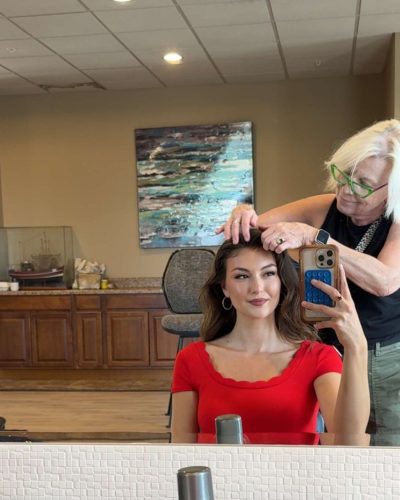 Rachel Pizzolato red dress complemented by black footwear