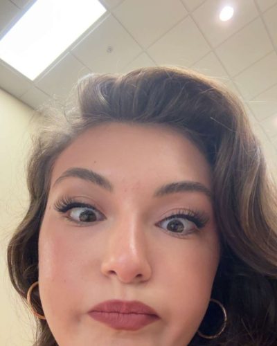 Rachel Pizzolato red dress with long flowing hair