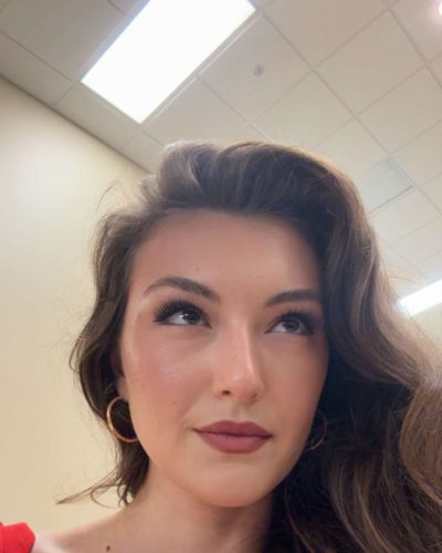 Rachel Pizzolato red dress paired with black high heels