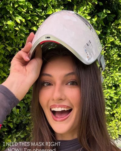 Rachel Pizzolato black knee-high boots complementing gray fitted dress