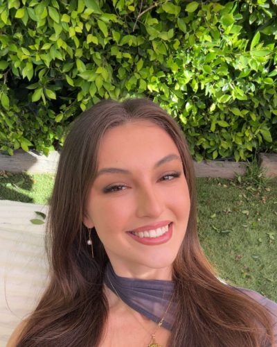 Rachel Pizzolato long sleeve gray dress with bold black boots