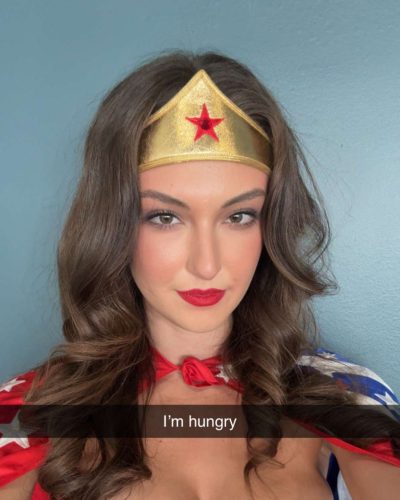 Rachel Pizzolato in a red top and flowing cape