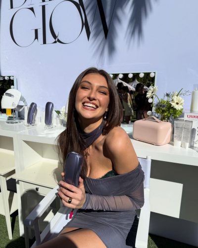 Rachel Pizzolato stylish gray mini dress and edgy black knee-high boots