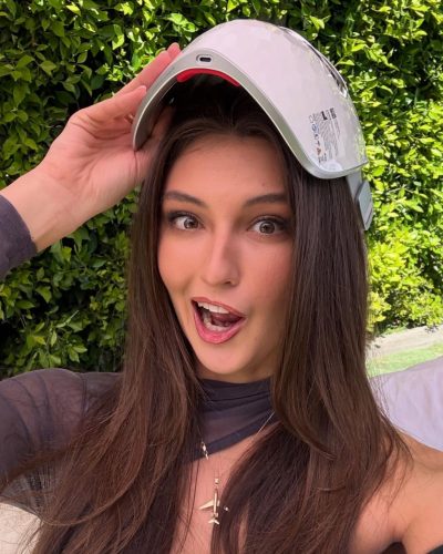 Rachel Pizzolato playful gray dress paired with knee-high black boots