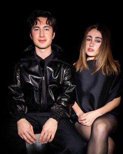 Rachel Sennott black off-shoulder dress with elegant heels