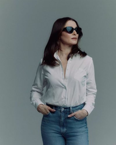 Rachel Weisz in warm blue wide-leg jeans paired with white top.