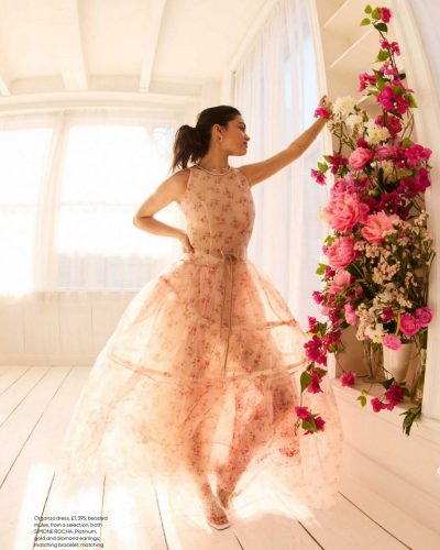 Rachel Zegler flowing sheer dress complemented by necklace