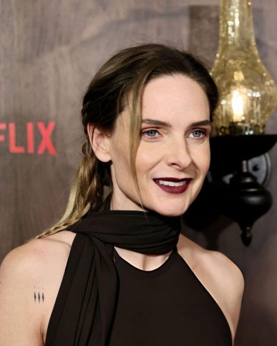 Rebecca Ferguon black gown accentuating her figure and silhouette