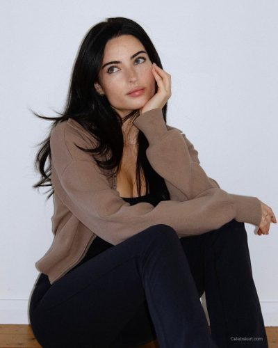 Renee Murden in bright yellow bikini with sandy elements.