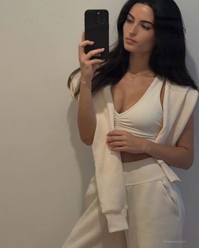 Renee Murden wearing yellow bikini while enjoying the waves.