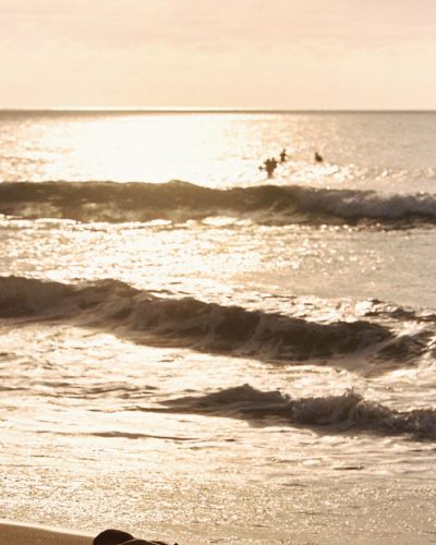 Renee Murden wearing yellow bikini while enjoying the waves.
