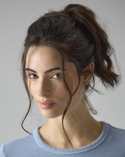 Renee Murden in yellow bikini against golden sunset backdrop.