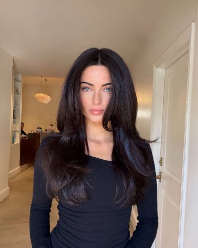 Renee Murden in bright yellow bikini enjoying sunny beach day.