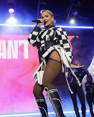 Rita Ora black bodysuit with leather checkered jacket