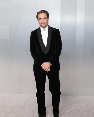Robert Pattinson wearing classic black tuxedo with white shirt