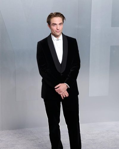 Robert Pattinson with black tuxedo featuring elegant satin lapel