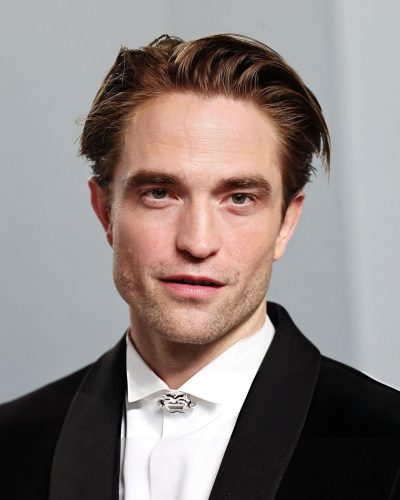 Robert Pattinson in crisp white shirt under black tuxedo