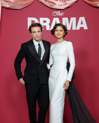 Robert Pattinson wearing sophisticated black suit with contrasting tie