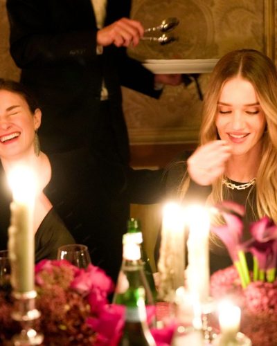 Rosie Huntington-Whiteley elegant black dress complemented by fur coat.