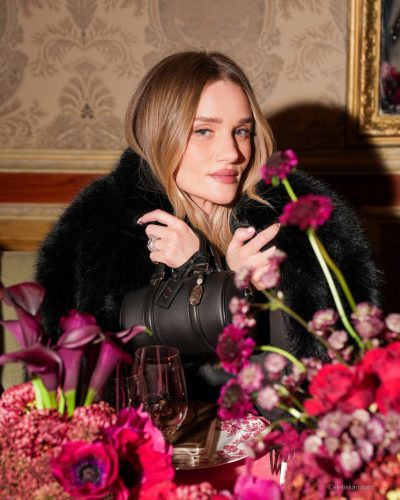 Rosie Huntington-Whiteley black fur coat and elegant black gown combination.