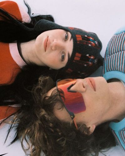 Rylee Stumpf flowy black skirt paired with colorful hoodie