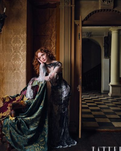 Sadie Sink in a floor-length black lace gown with layers.