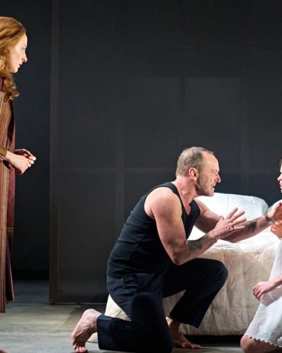 Sadie Sink styled in red dress accentuating her figure.