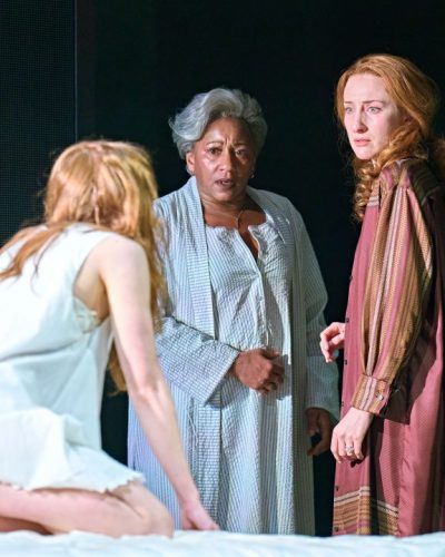 Sadie Sink in ethereal white linens during performance.