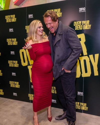 Samara Weaving bright red dress with ruched elements