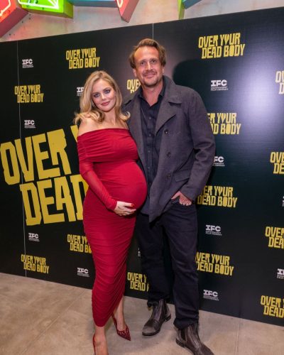 Samara Weaving flowing red gown with soft waves hairstyle