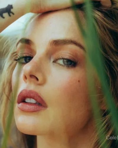 Samara Weaving in white bridal gown with intricate waist embellishments