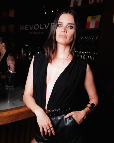 Sara Sampaio in sheer black tights paired with leather shorts.