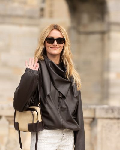 Sarah Pidgeon black leather jacket complemented by white pants