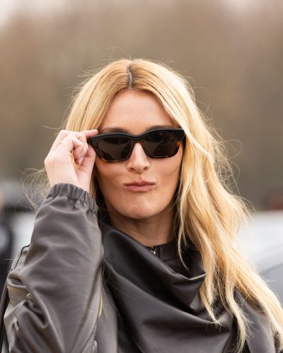 Sarah Pidgeon black leather jacket and soft white pants