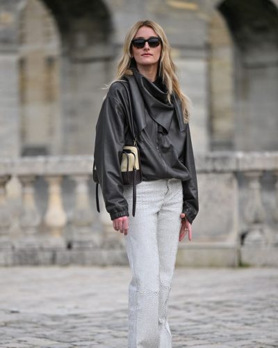 Sarah Pidgeon black leather jacket and light-colored pants