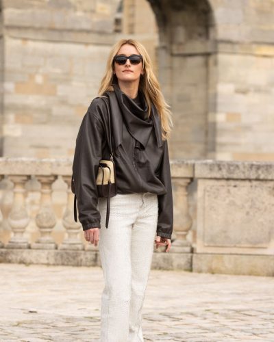 Sarah Pidgeon black leather jacket with neutral-toned bag