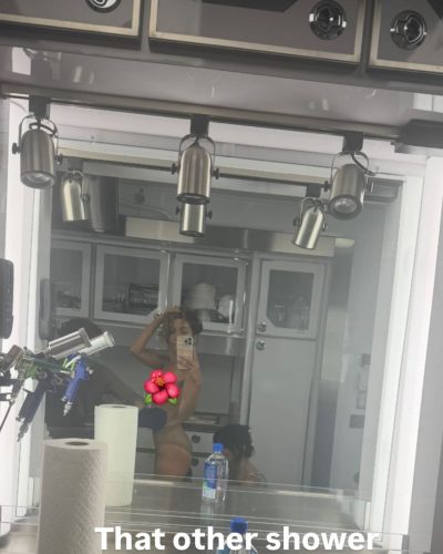 Sarah Shahi in vibrant floral robe with light colors