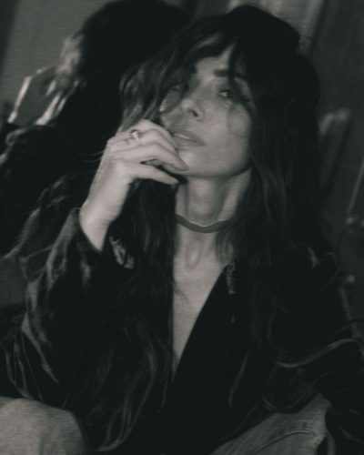 Sarah Shahi fitted jeans paired with deep blue velvet jacket