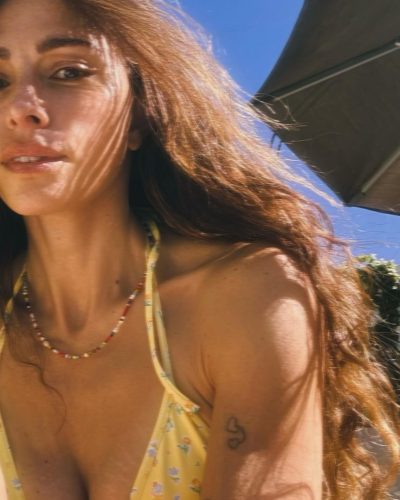 Sarah Shahi fashionable deep blue velvet jacket and denim