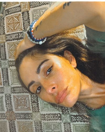 Sarah Shahi luxurious deep blue velvet jacket with denim