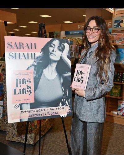 Sarah Shahi deep blue velvet jacket complemented by rings