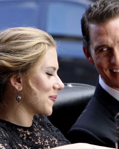 Scarlett Johansson stylish black lace dress against city lights