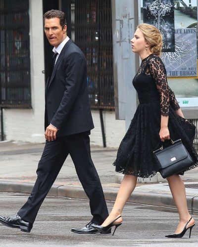 Scarlett Johansson chic black dress with delicate earrings