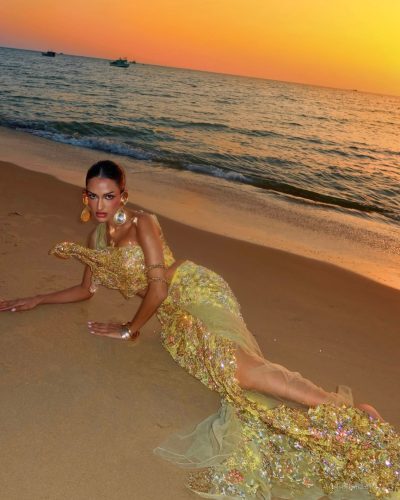 Seerat Saini showcases a golden crop top with flowing skirt.