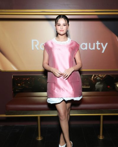 Selena Gomez vibrant pink satin dress featuring unique silhouette
