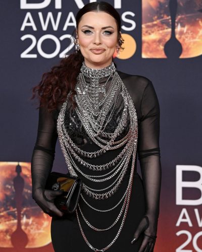 Shona McGarty in black gown paired with stylish black gloves