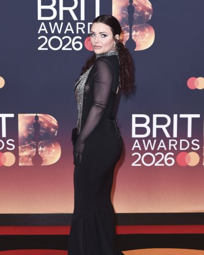 Shona McGarty in black gown featuring dramatic chain embellishments