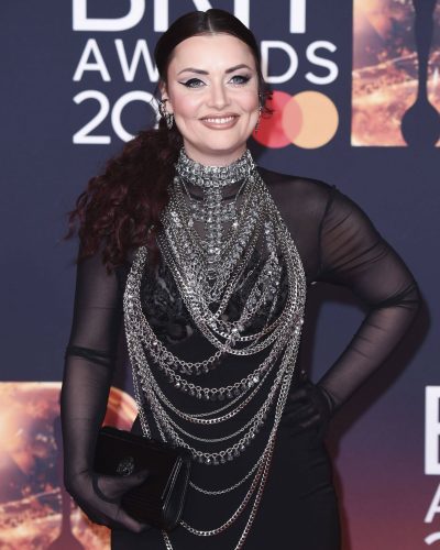 Shona McGarty wearing a black gown with intricate chain design