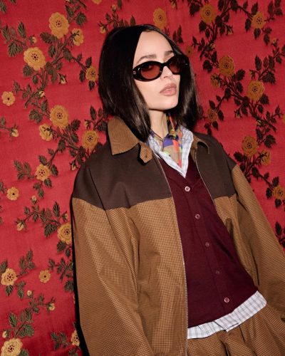 Sofia Carson wearing brown jacket at appearance 2026